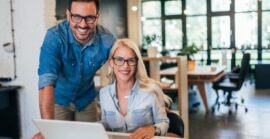 business professionals using banking services on laptop