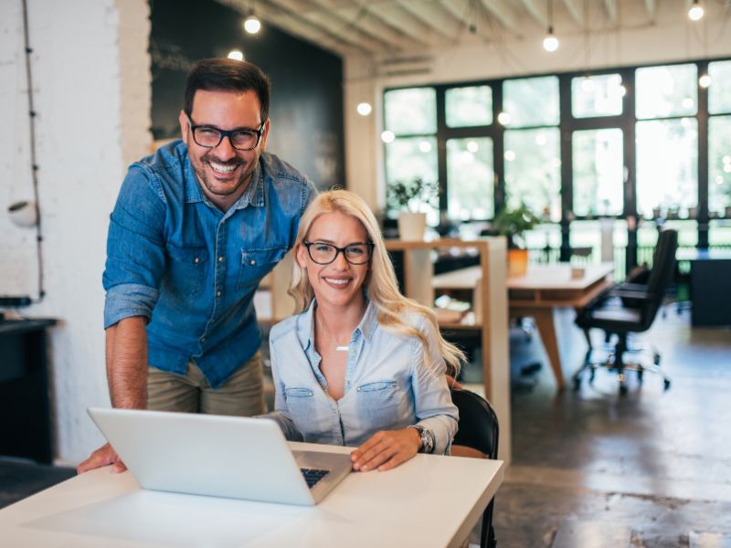 business professionals using banking services on laptop