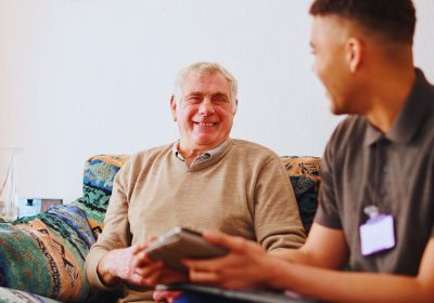 elderly person sitting on a couch